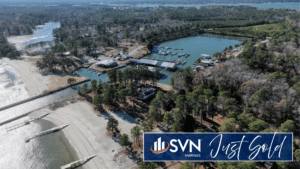 Aerial view of Coles Point Marina & RV Resort on the Potomac River, showcasing the marina, RV accommodations, waterfront amenities, and surrounding 335-acre property featured in the Coles Point Marina & RV Resort sale by SVN Marinas.