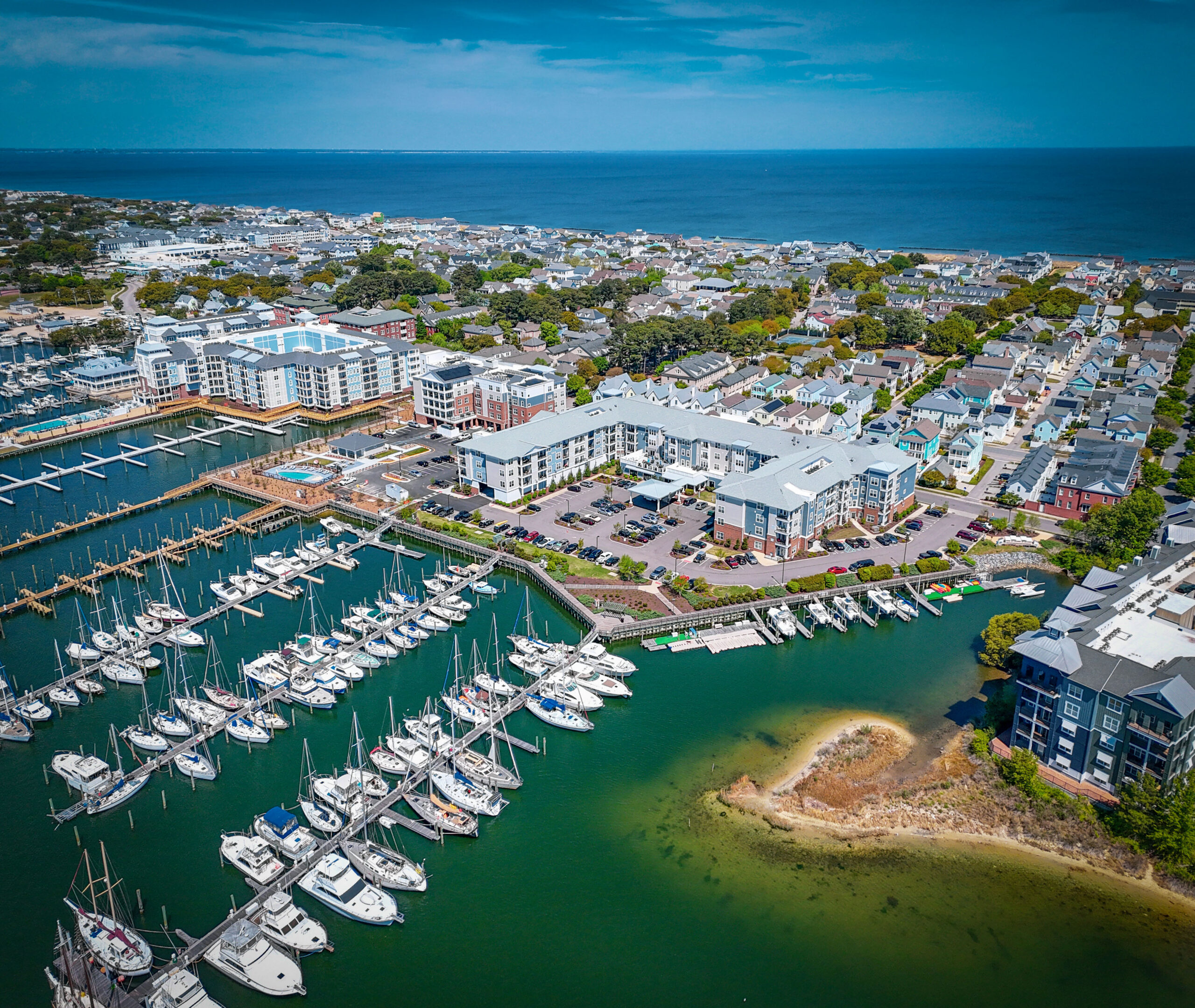 Aerial view of Little Creek Marina in Norfolk, Virginia with boats, docks, and waterfront residential development along the Chesapeake Bay